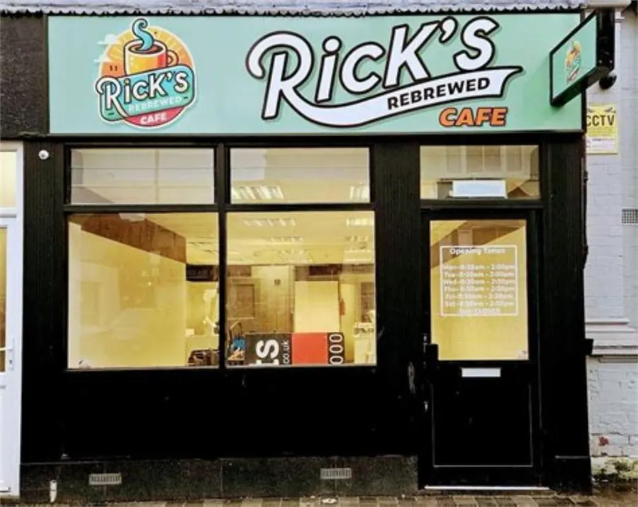 Rick's Rebrewed Cafe storefront with opening times on the door in Grimsby